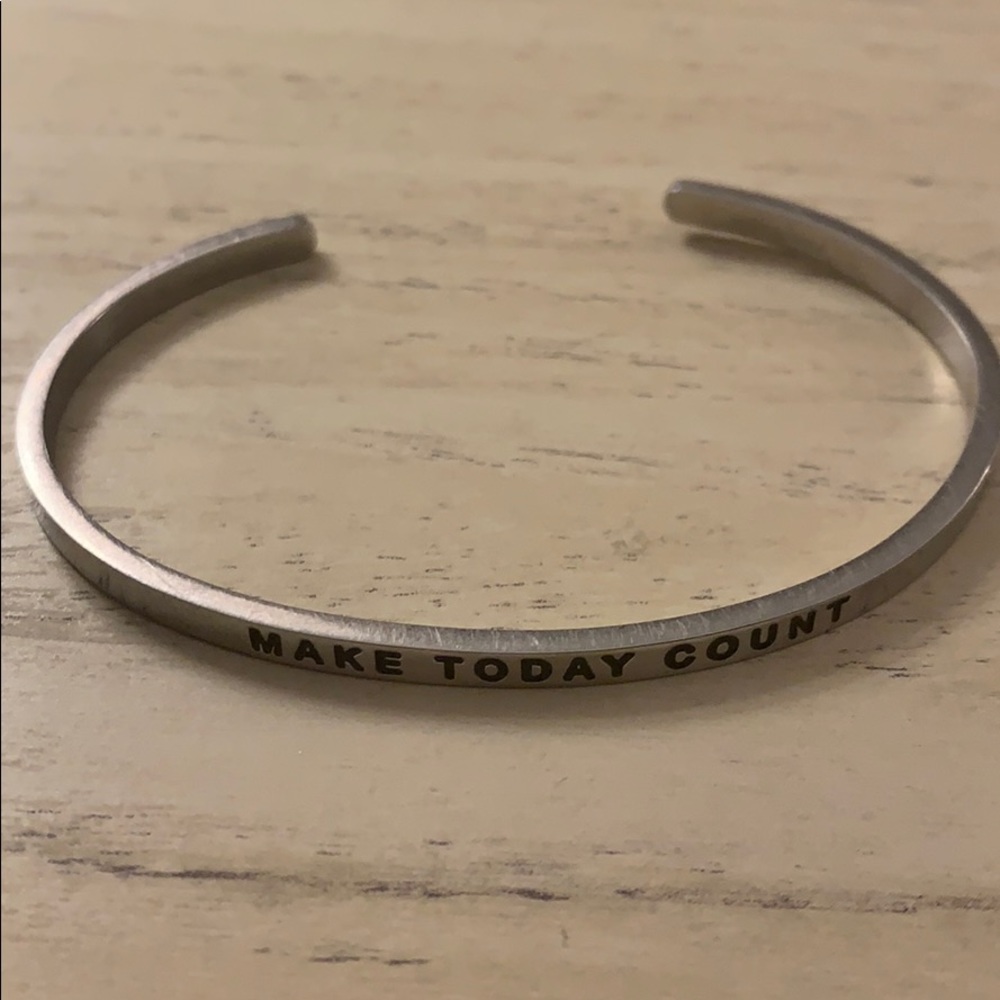 thin Mantra cuff bracelet.
